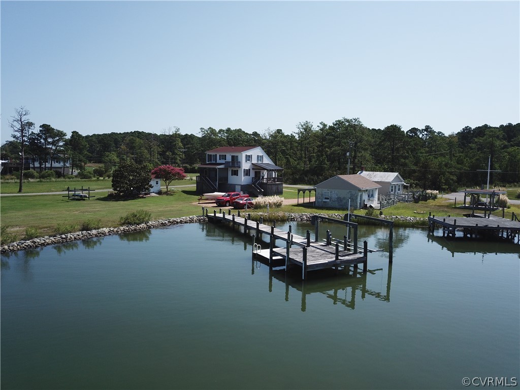 4773 Windmill Point Road White Stone, VA 22578 - Photo 10 of 36 a view of a lake with outdoor seating