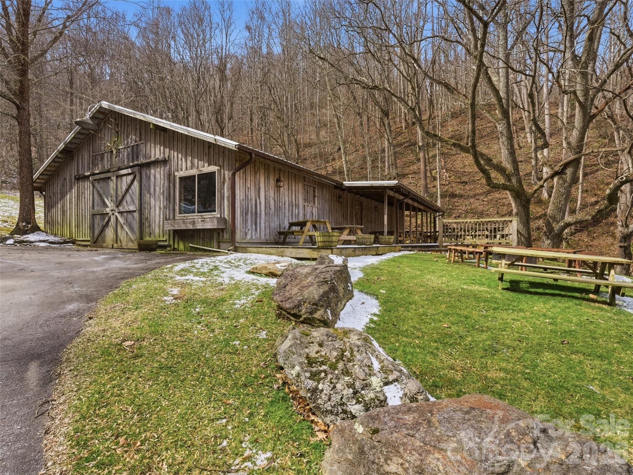 301 Awohali Trail Maggie Valley, NC 28751 - Photo 26 of 31 a backyard of a house with yard and outdoor seating