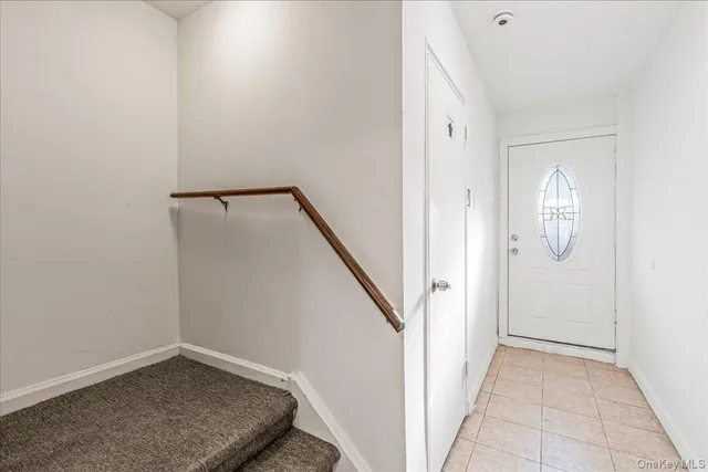a view of an house with backyard and a fence