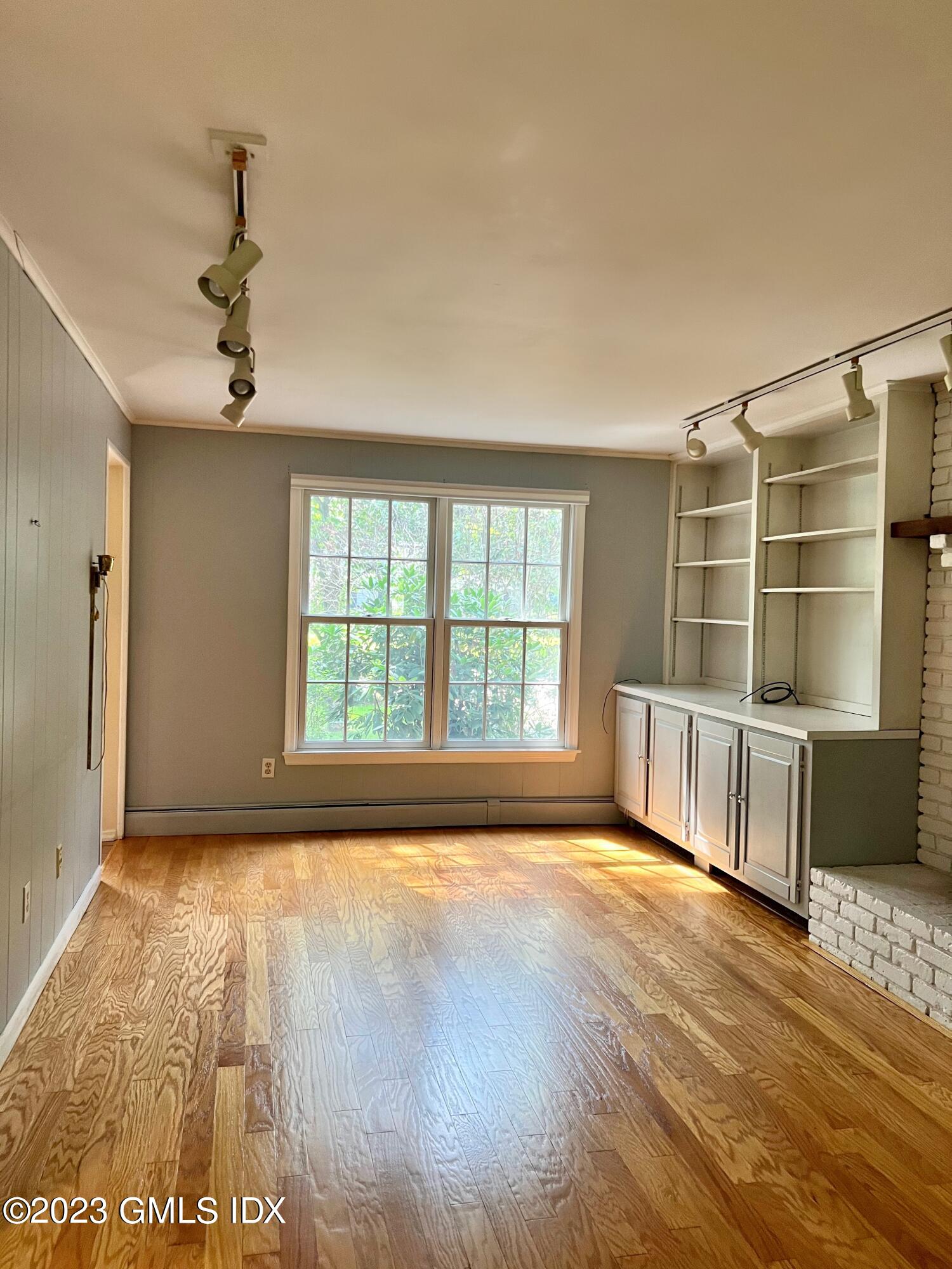 5 Tory Road Riverside, CT 06878 - Photo 12 of 26 a view of an empty room with a window and wooden floor