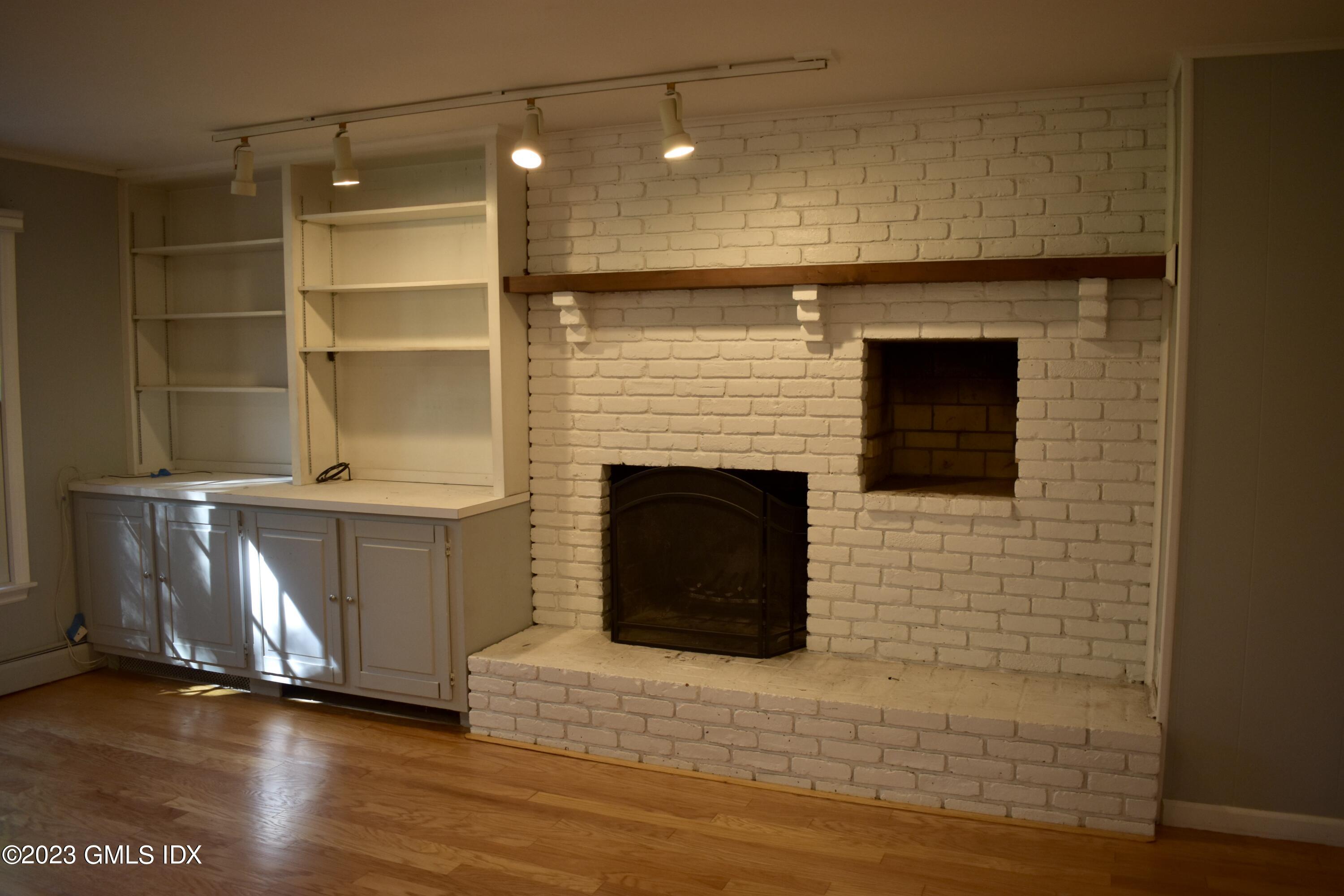 5 Tory Road Riverside, CT 06878 - Photo 13 of 26 a living room with a fireplace