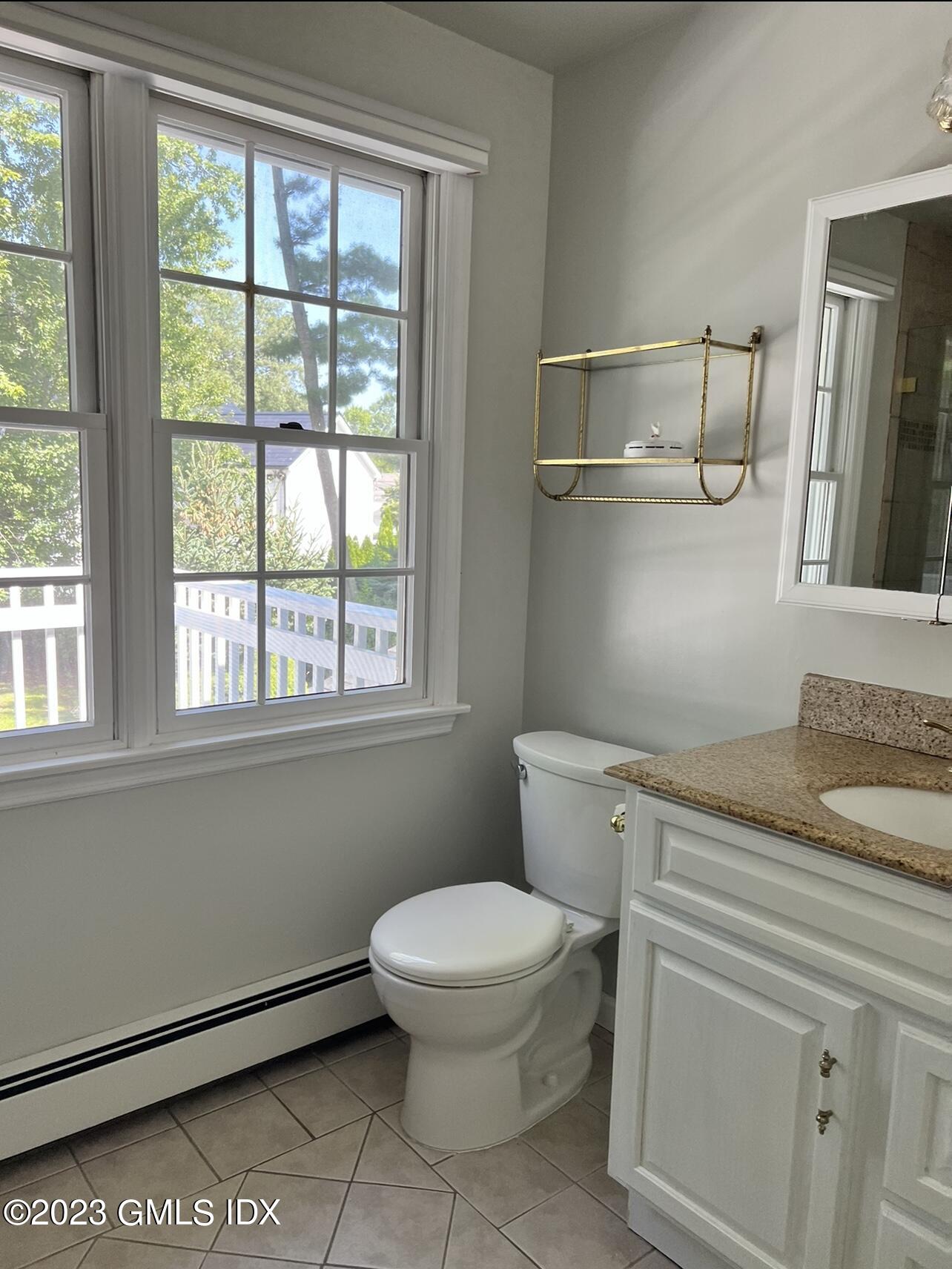 5 Tory Road Riverside, CT 06878 - Photo 14 of 26 a bathroom with a granite countertop toilet sink and mirror