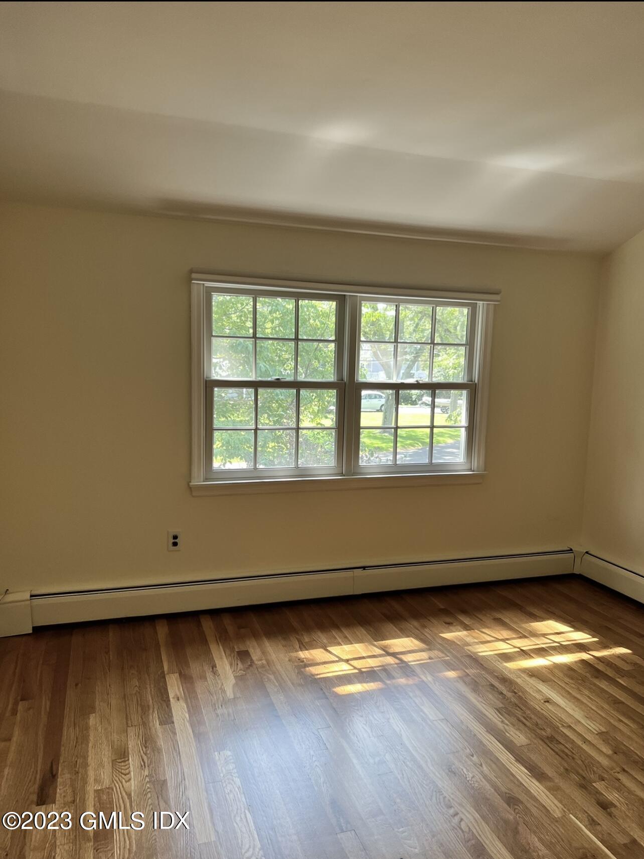 5 Tory Road Riverside, CT 06878 - Photo 19 of 26 an empty room with wooden floor and windows