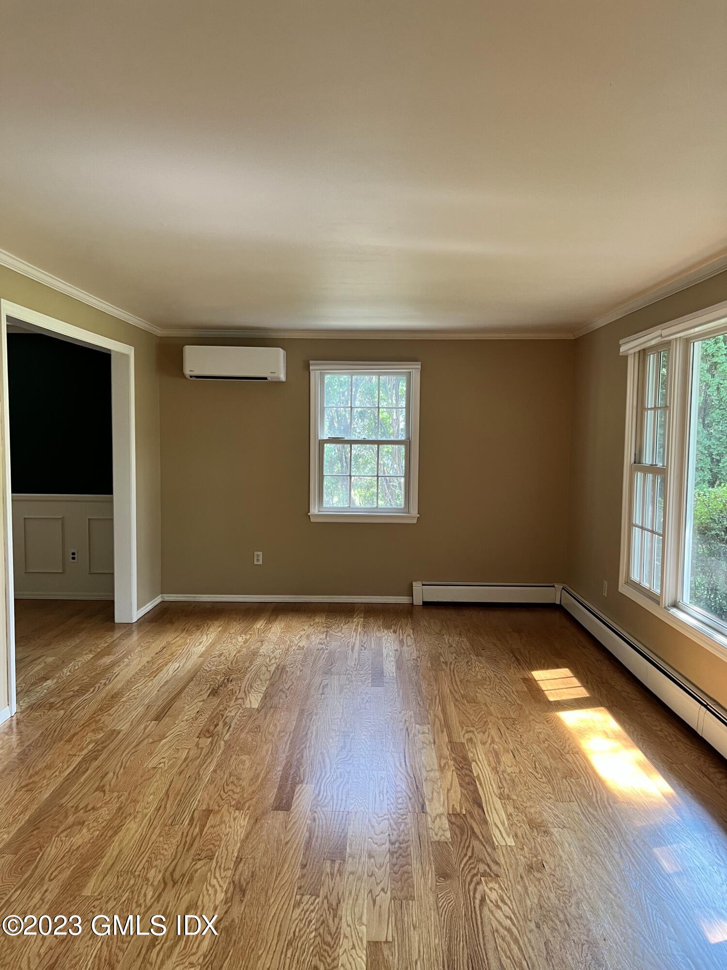 5 Tory Road Riverside, CT 06878 - Photo 9 of 26 an empty room with wooden floor and windows