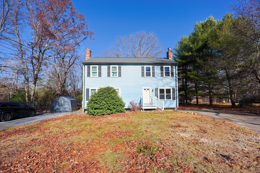 131 Harkness Road, Unit B Millville, MA 01529 - Photo 2 of 41 a front view of a house with a yard
