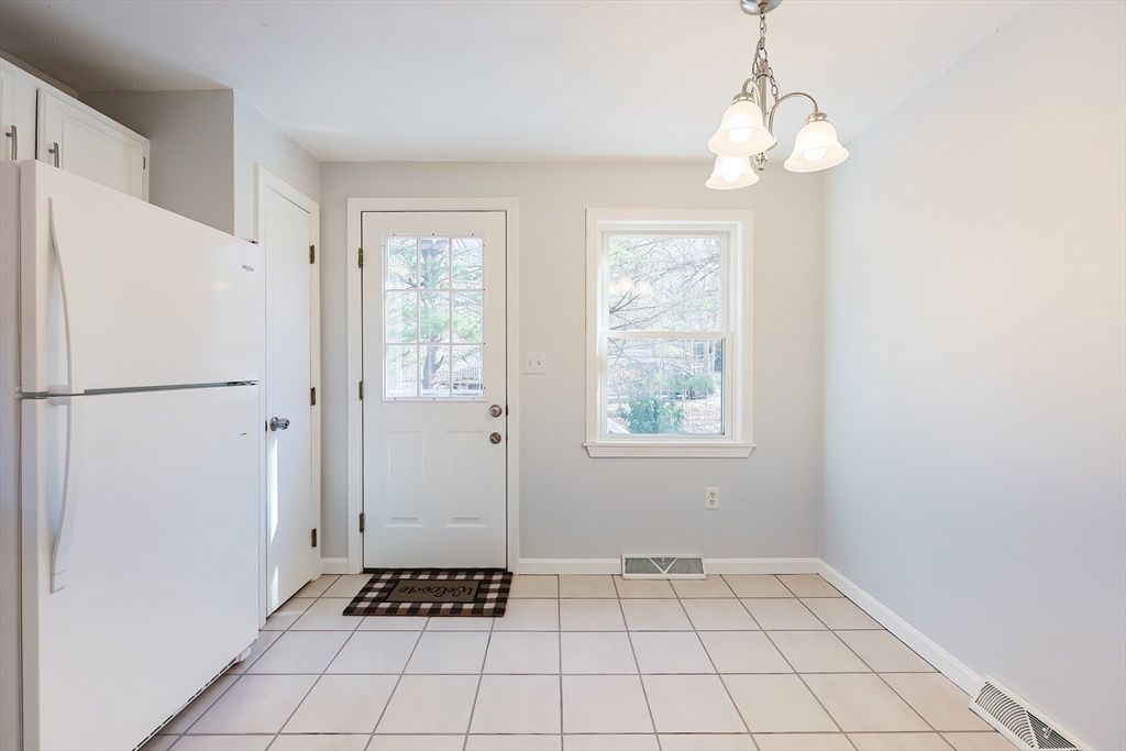 131 Harkness Road, Unit B Millville, MA 01529 - Photo 21 of 41 a view of an entryway with a chandelier
