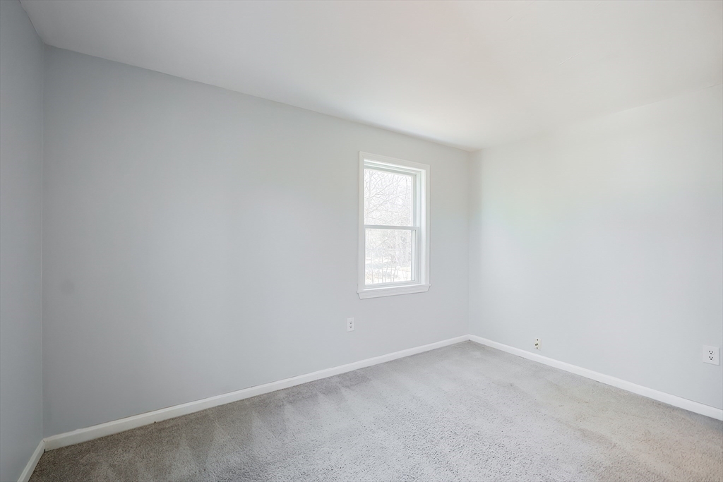 131 Harkness Road, Unit B Millville, MA 01529 - Photo 36 of 41 an empty room with a window