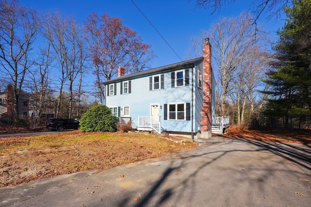 131 Harkness Road, Unit B Millville, MA 01529 - Photo 4 of 41 a front view of a house with a yard