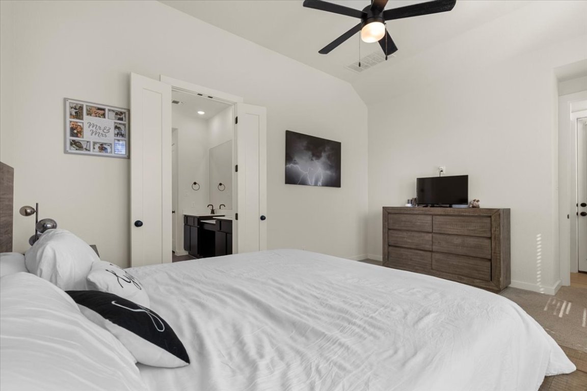 1020 Highcrest Georgetown, TX 78628 - Photo 15 of 39 a bedroom with a bed and a flat screen tv