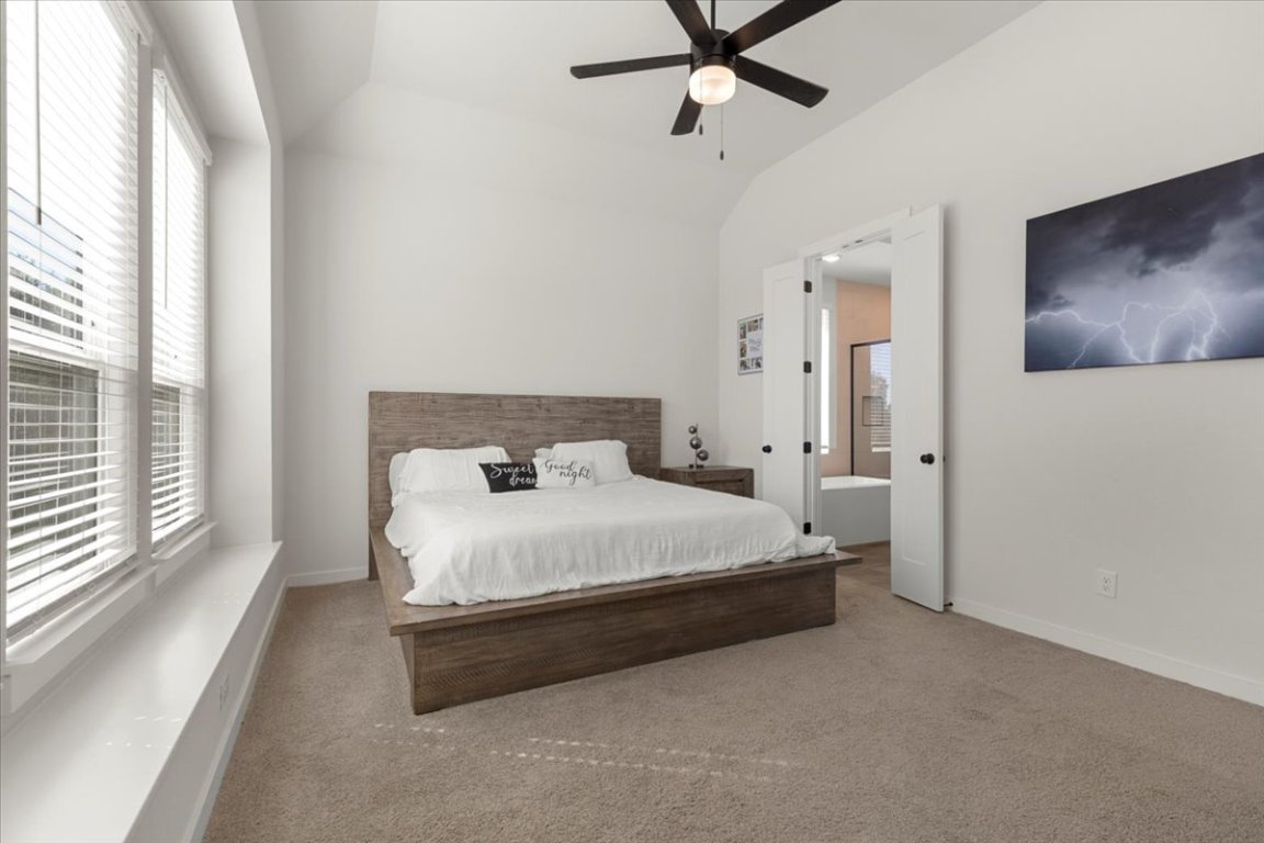 1020 Highcrest Georgetown, TX 78628 - Photo 16 of 39 a bedroom with a bed and large windows