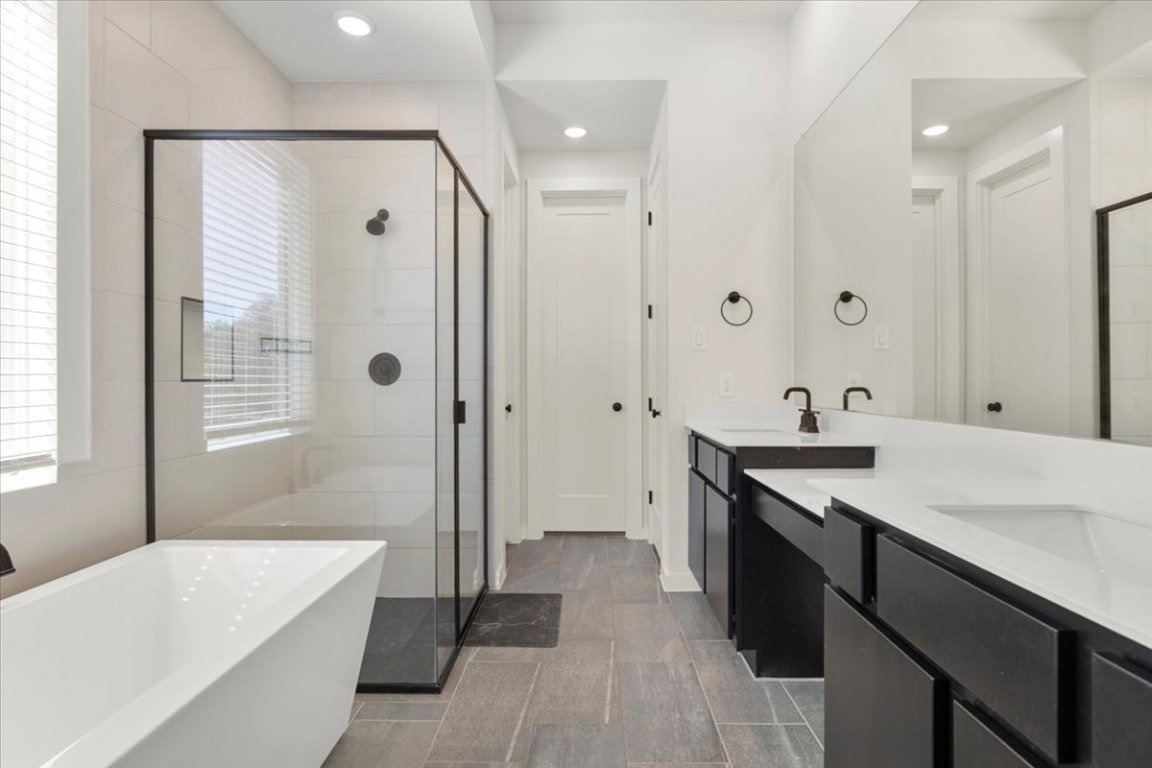 1020 Highcrest Georgetown, TX 78628 - Photo 17 of 39 a bathroom with a tub sink and mirror