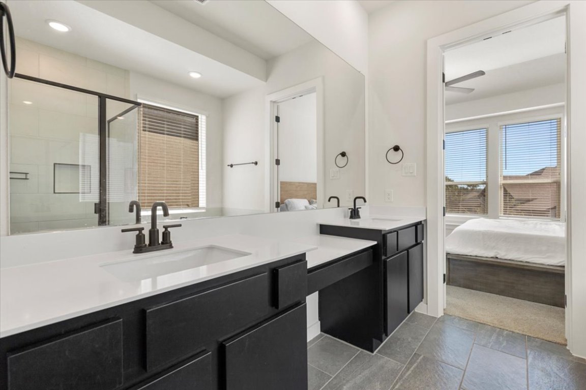 1020 Highcrest Georgetown, TX 78628 - Photo 18 of 39 a bathroom with a sink double vanity and a mirror