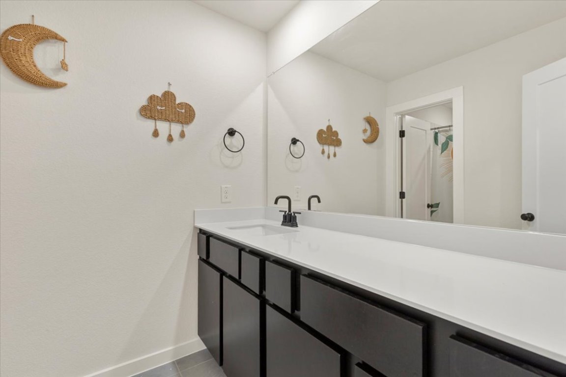1020 Highcrest Georgetown, TX 78628 - Photo 24 of 39 a bathroom with a sink and a mirror