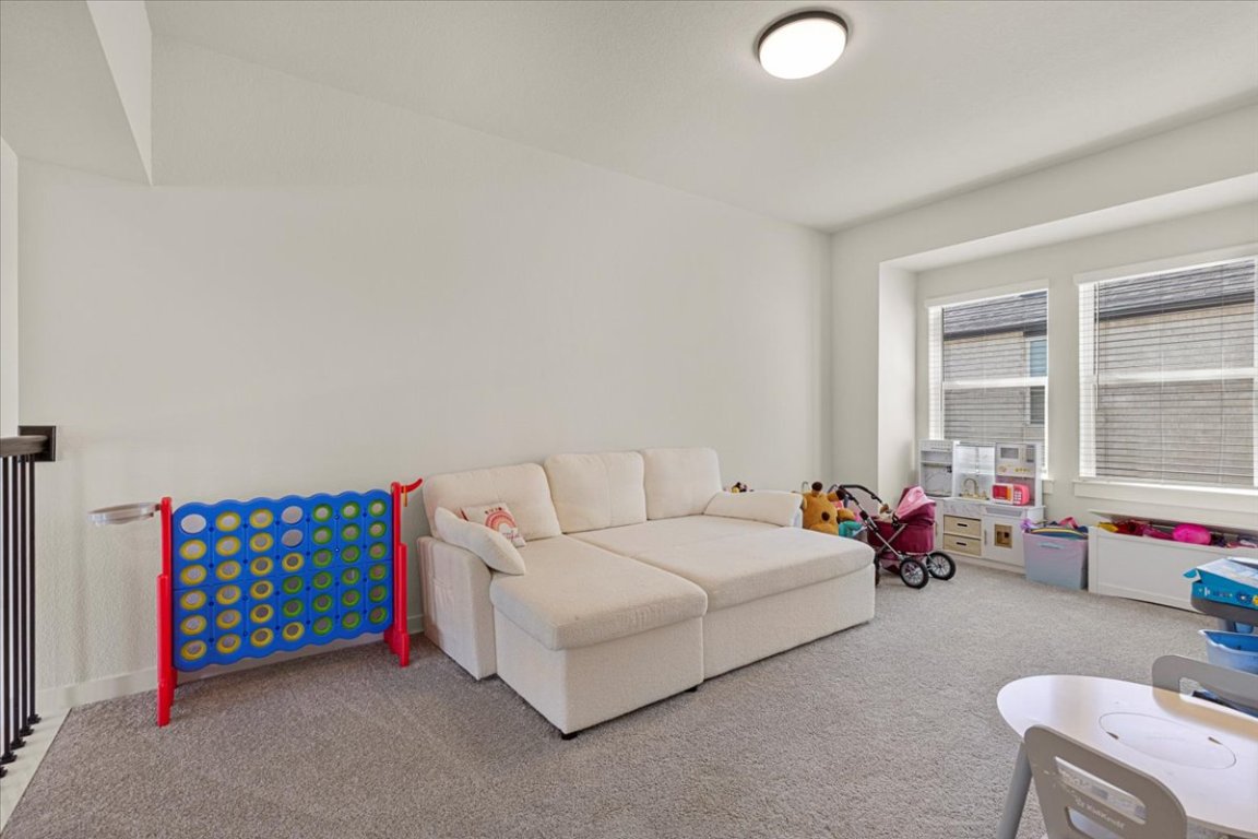 1020 Highcrest Georgetown, TX 78628 - Photo 26 of 39 a bedroom with furniture and a large window
