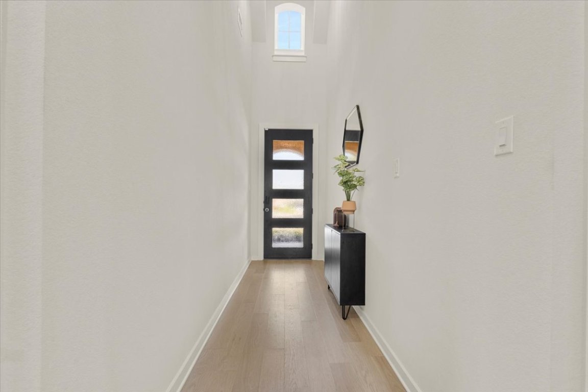 1020 Highcrest Georgetown, TX 78628 - Photo 4 of 39 a view of a hallway with wooden floor and staircase