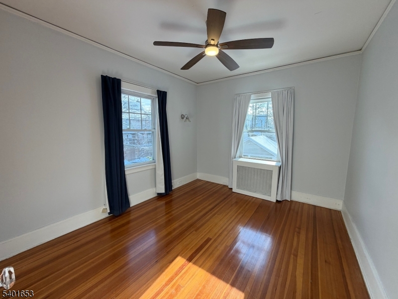 63 Watchung Avenue, Unit 2 Montclair, NJ 07043 - Photo 14 of 21 a view of empty room with wooden floor and fan