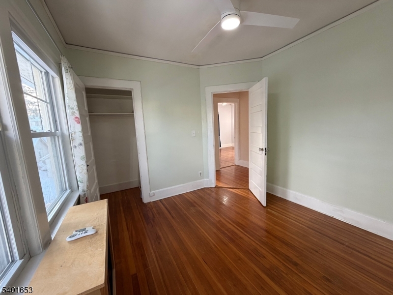 63 Watchung Avenue, Unit 2 Montclair, NJ 07043 - Photo 17 of 21 an empty room with wooden floor and a window