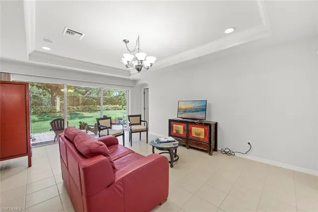 a kitchen with kitchen island a counter top stainless steel appliances and a center island