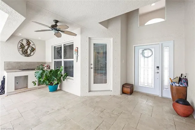a livingroom with workspace and a window