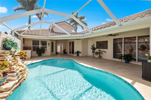 a room with wooden floors table and chairs