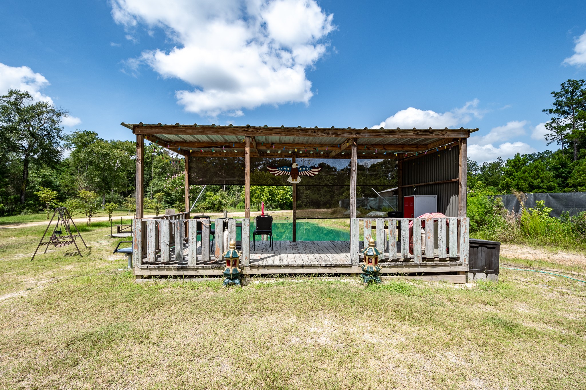 0 Willingham Lane Conroe, TX 77306 - Photo 16 of 27 Covered Porch sitting by Pond