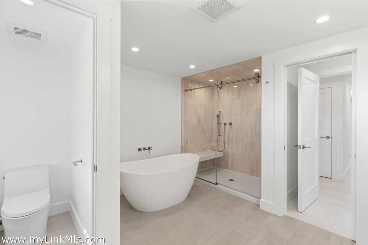 3 Tautemo Way Nantucket, MA 02554 - Photo 36 of 57 a spacious bathroom with a toilet and a bathtub