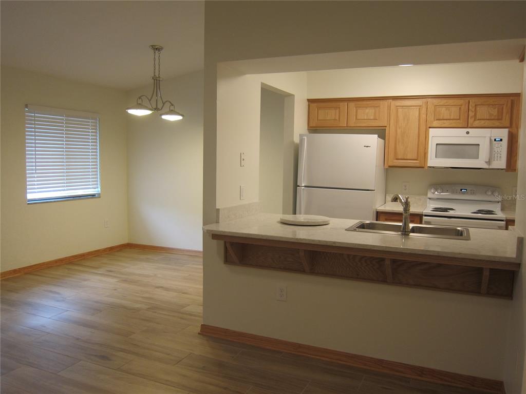7023 Southwest 21st Lane Gainesville, FL 32607 - Photo 13 of 27 a bathroom with a sink and a mirror