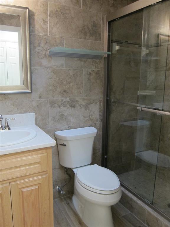 7023 Southwest 21st Lane Gainesville, FL 32607 - Photo 18 of 27 a bathroom with a sink and a toilet