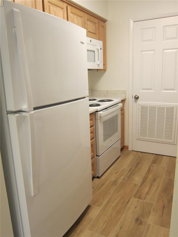 7023 Southwest 21st Lane Gainesville, FL 32607 - Photo 6 of 27 a white refrigerator freezer sitting inside of a kitchen