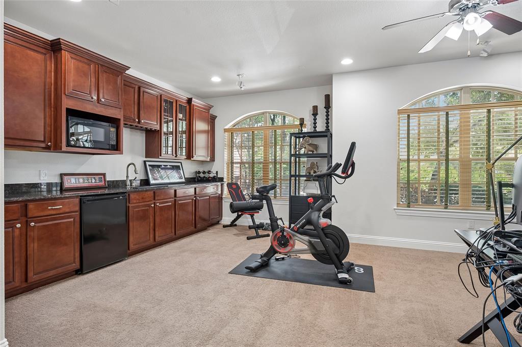 835 Rockingham Drive Irving, TX 75063 - Photo 22 of 30 The first floor currently doubles as a gym.