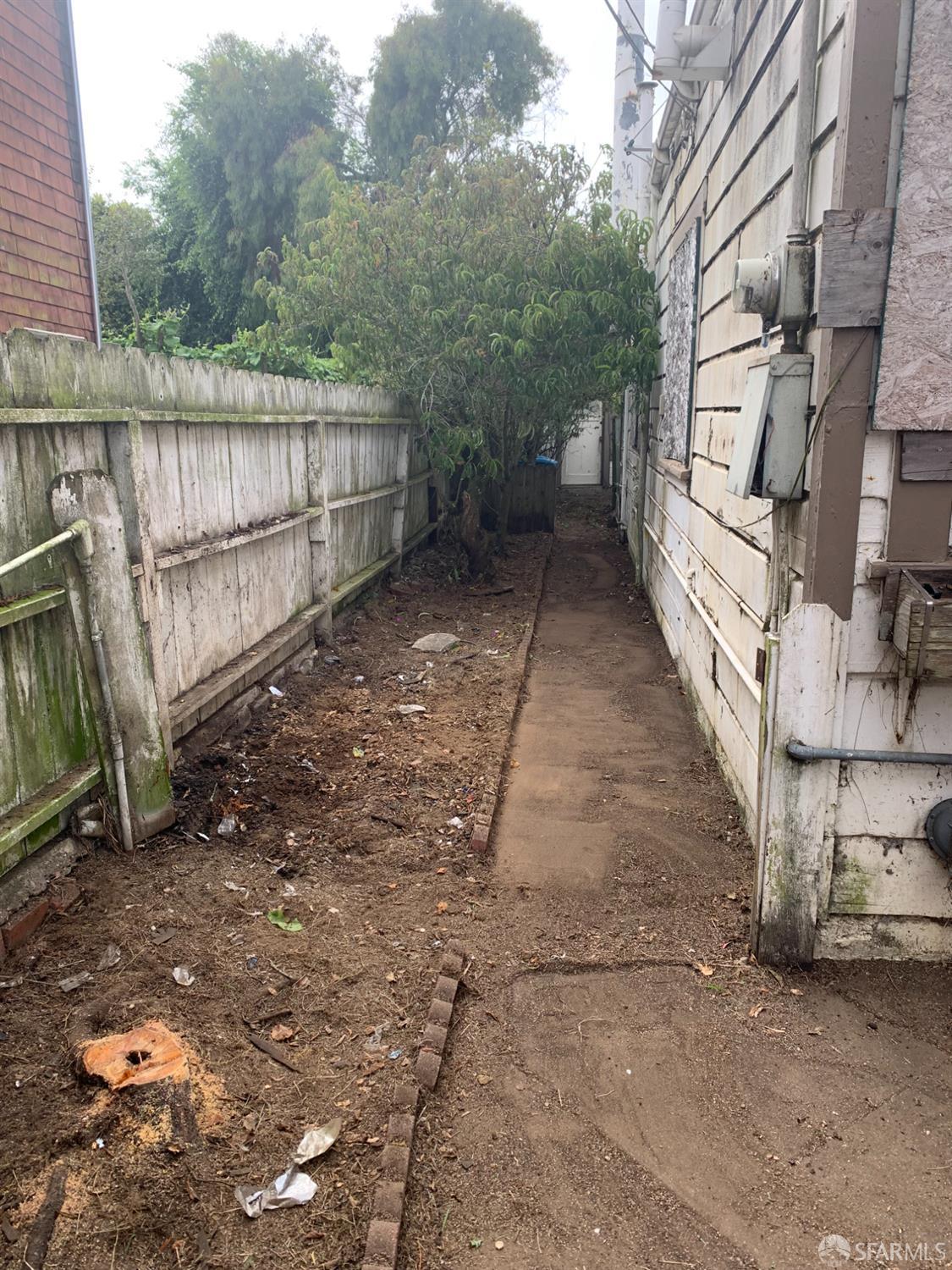 271 Granada Avenue San Francisco, CA 94112 - Photo 6 of 12 a view of a backyard with wooden fence