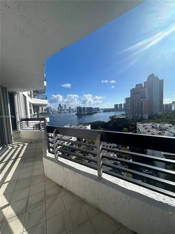 a view of a kitchen with stainless steel appliances a stove and cabinets
