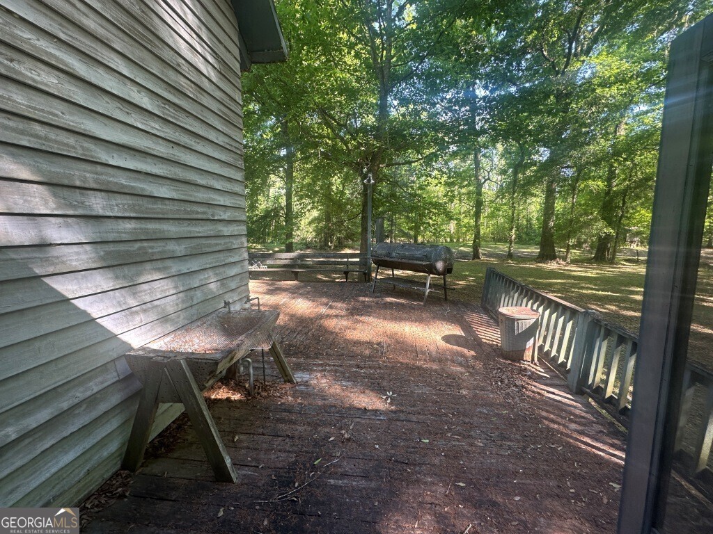 0 Old Poor Robin Road Sylvania, GA 30467 - Photo 19 of 25 a view of backyard with table and chairs and wooden fence