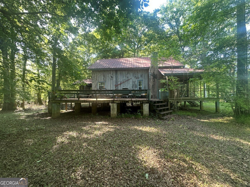 0 Old Poor Robin Road Sylvania, GA 30467 - Photo 4 of 25 a view of a house with backyard porch and sitting area