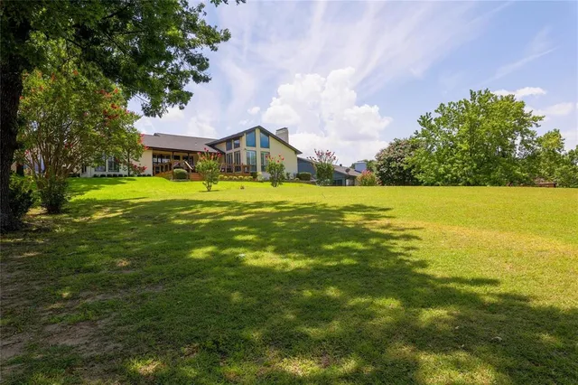 a view of a house with a big yard