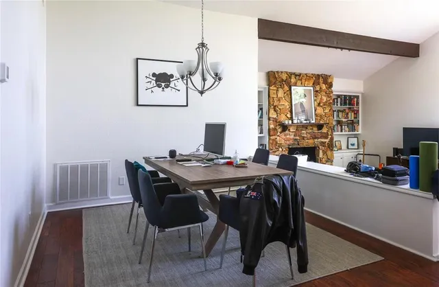 a view of a dining room with furniture and window