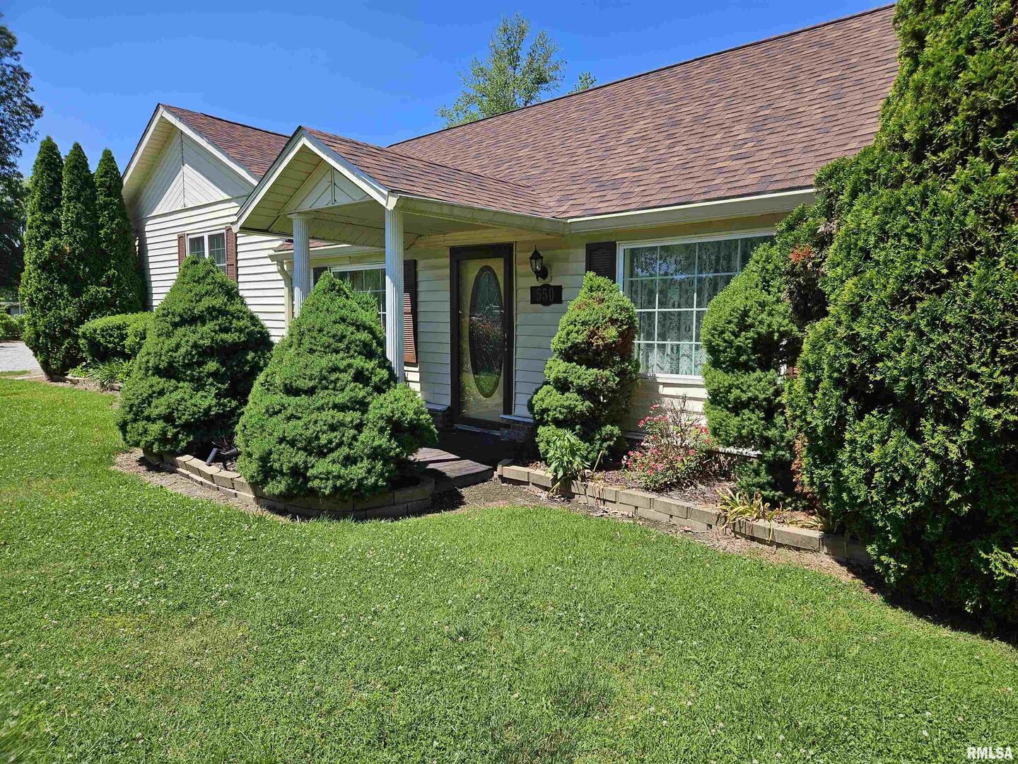 550 South Vienna Road Olmsted, IL 62970 - Photo 3 of 31 a front view of a house with a garden and plants