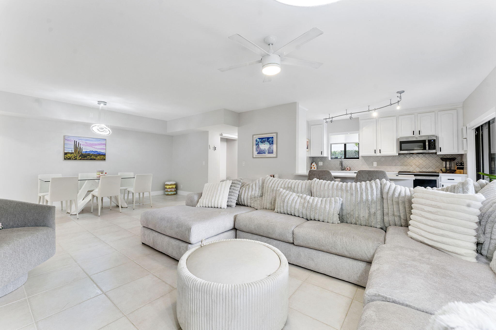 6314 Longboat Lane West, Unit A102 Boca Raton, FL 33433 - Photo 12 of 24 a living room with furniture and kitchen view