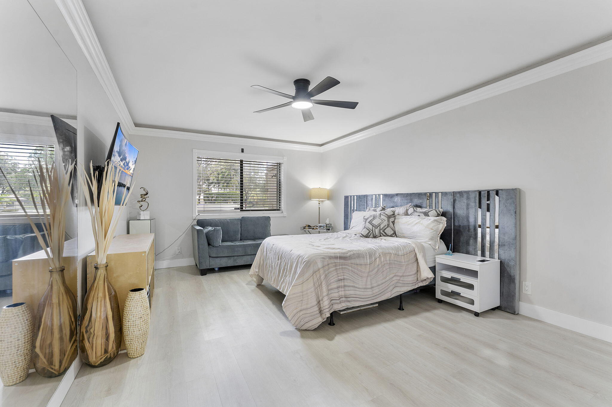 6314 Longboat Lane West, Unit A102 Boca Raton, FL 33433 - Photo 15 of 24 a bedroom with a bed and a walk in closet