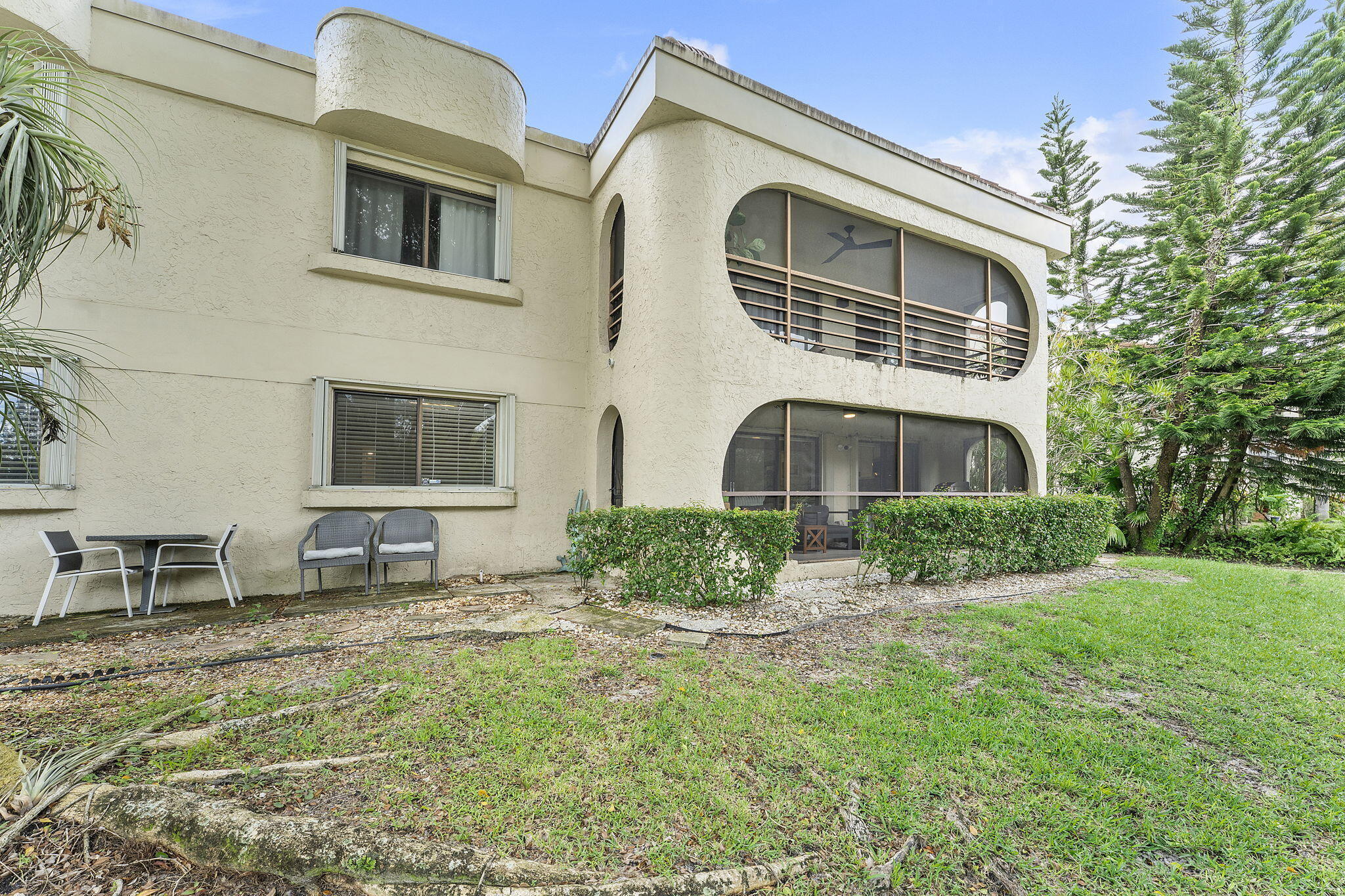 6314 Longboat Lane West, Unit A102 Boca Raton, FL 33433 - Photo 24 of 24 a front view of a house with a yard