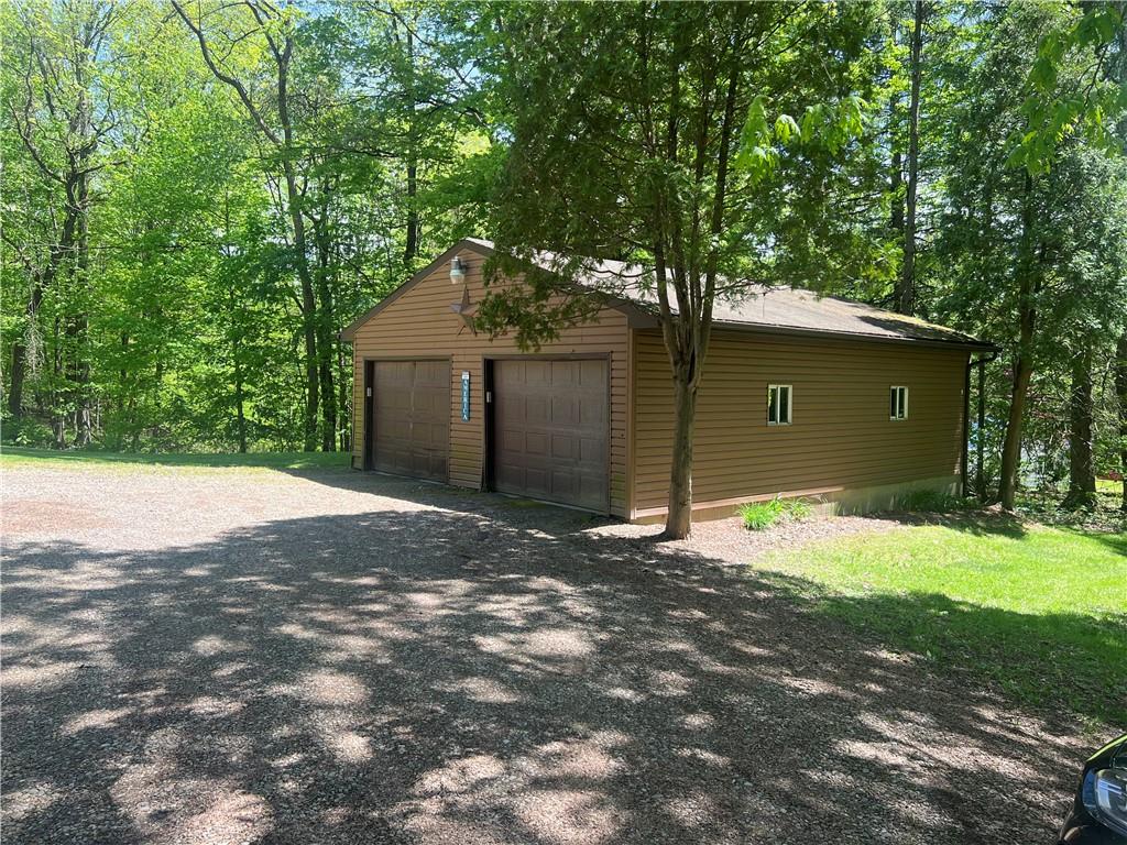 121 Pitts Road Jamestown, PA 16134 - Photo 9 of 28 a backyard of a house with yard and tree