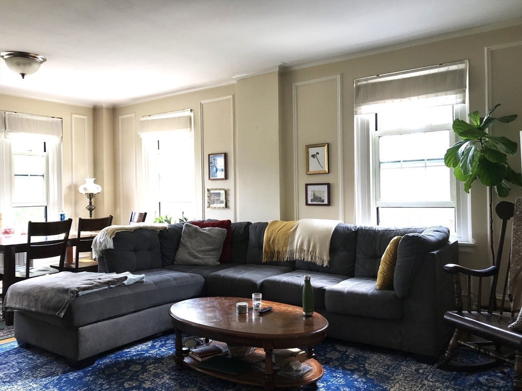 1450 Beacon Street, Unit 342 Brookline, MA 02446 - Photo 15 of 16 a living room with furniture and a large window