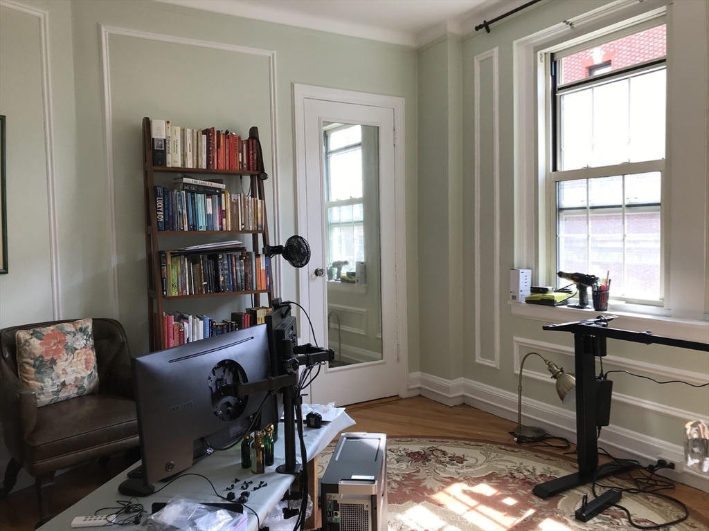 1450 Beacon Street, Unit 342 Brookline, MA 02446 - Photo 4 of 16 a room with furniture and a window