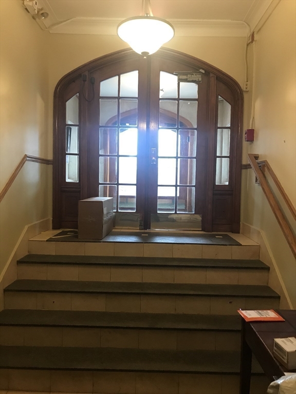 1450 Beacon Street, Unit 342 Brookline, MA 02446 - Photo 8 of 16 a view of entryway and hall with wooden floor
