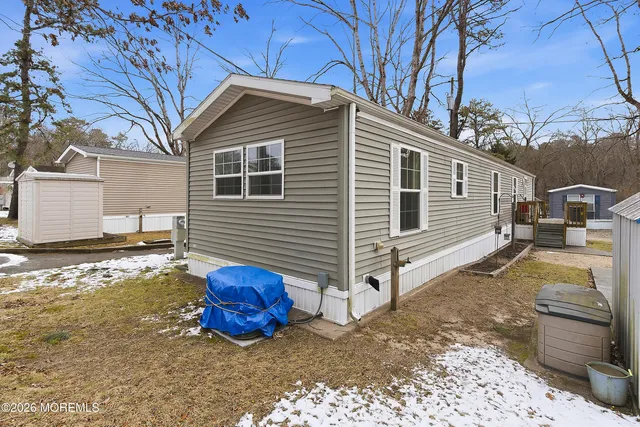 a front view of a house with parking space