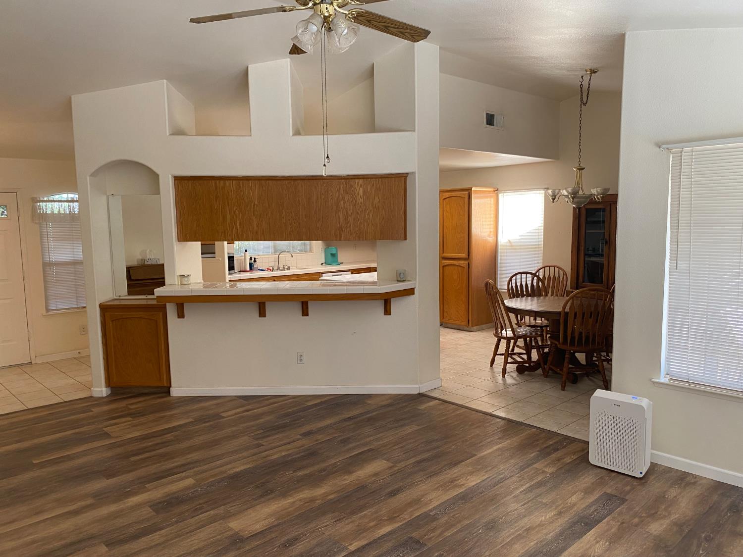 609 Merlot Avenue Madera, CA 93637 - Photo 15 of 45 a view of cabinets a sink wooden floor and a window