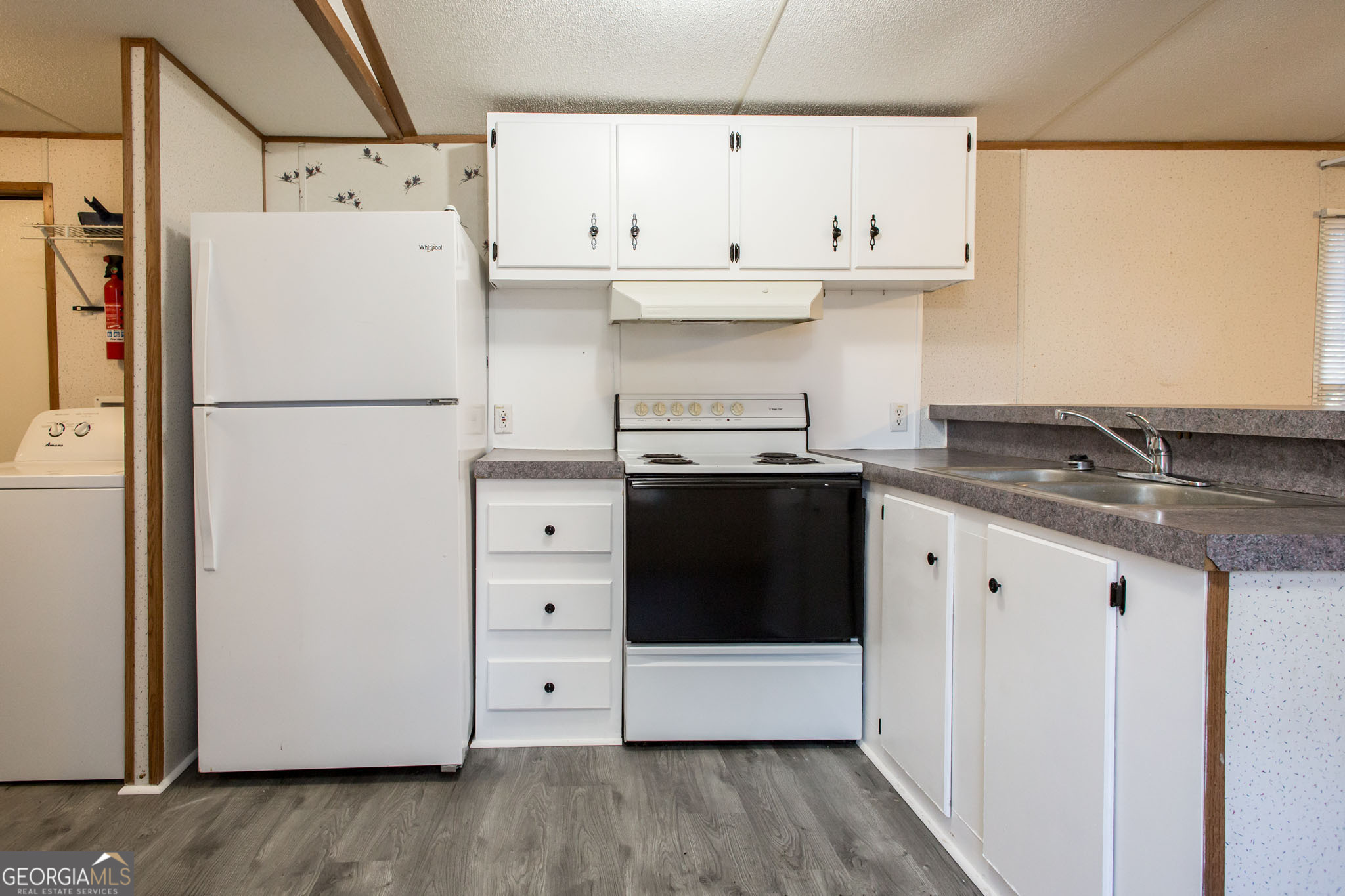 6005 Chancey Road Patterson, GA 31557 - Photo 11 of 23 a white refrigerator freezer sitting inside of a kitchen