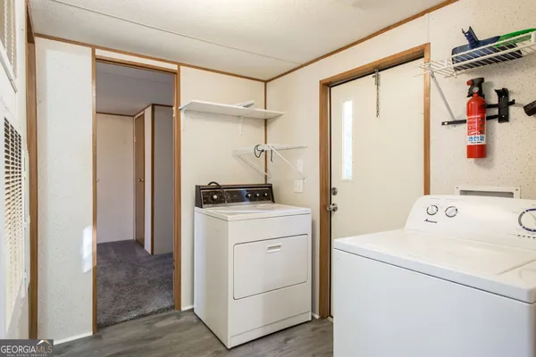 a storage room with washer and dryer