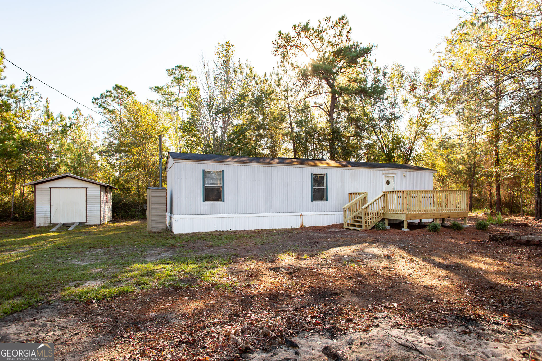 6005 Chancey Road Patterson, GA 31557 - Photo 2 of 23 a view of a house with a yard