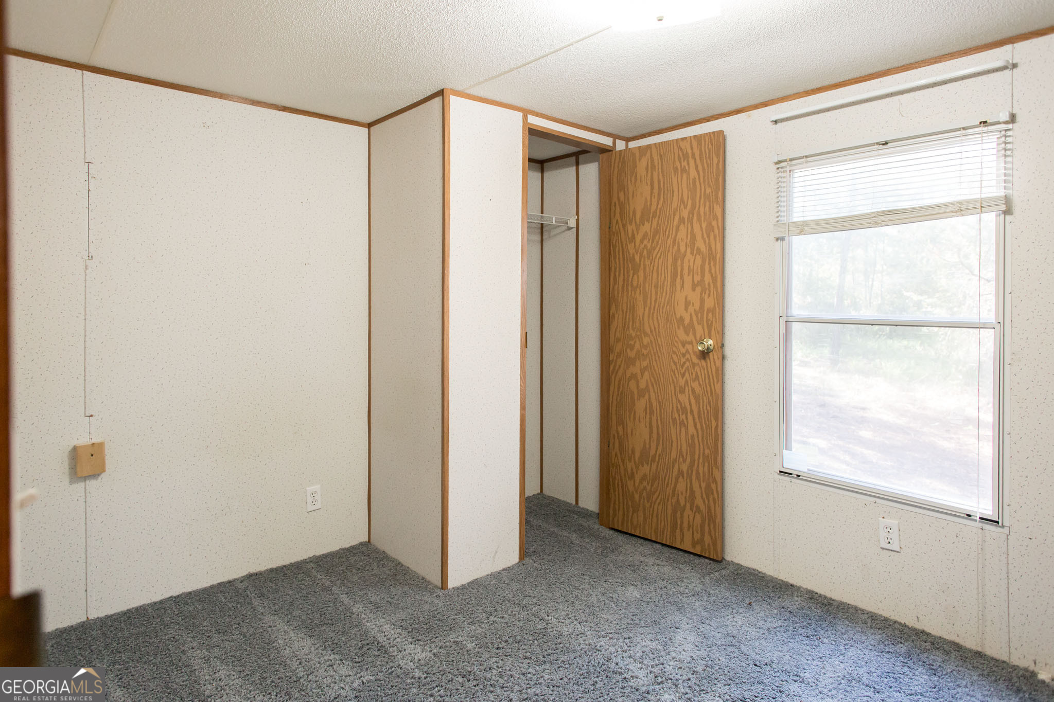 6005 Chancey Road Patterson, GA 31557 - Photo 6 of 23 a view of an empty room with a window